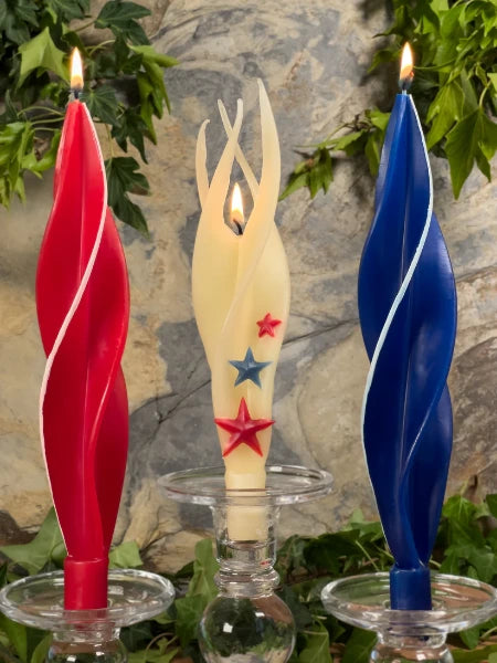 Lit red white blue star beeswax candles