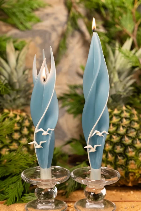 Lit light blue seagull silhouette beeswax candles