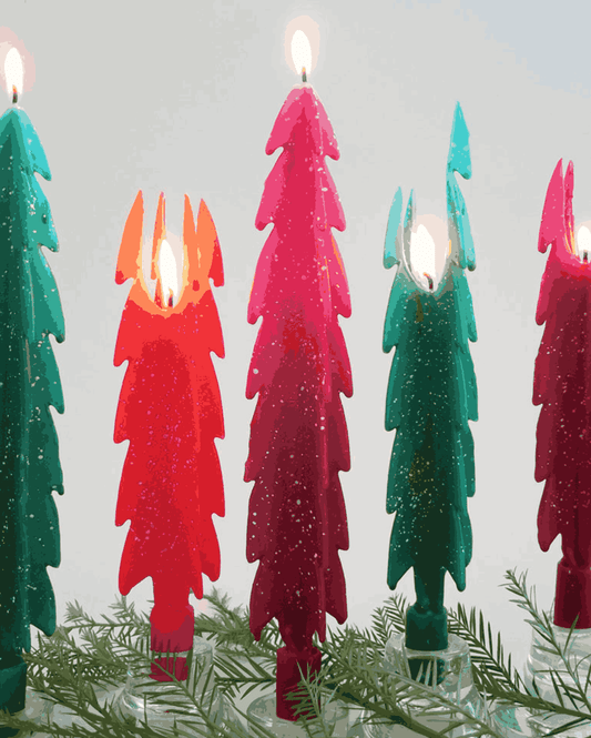 Colorful lit Christmas tree-shaped beeswax candles